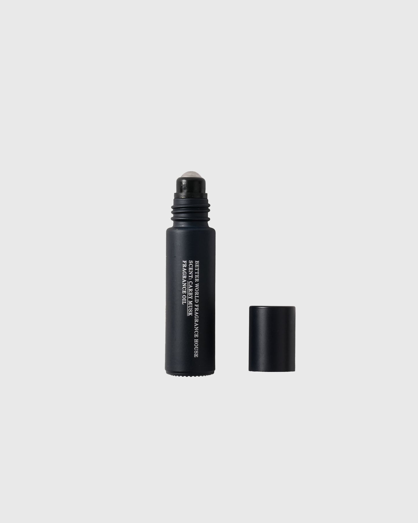 Black roller ball fragrance bottle with matching cap removed, showing roll-on applicator top.