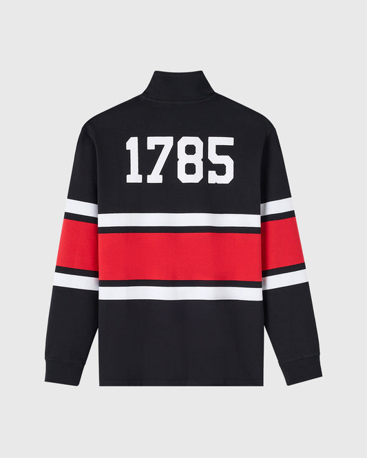 Black rugby pullover with quarter-zip, red and white horizontal stripes, and "1785" printed on chest.