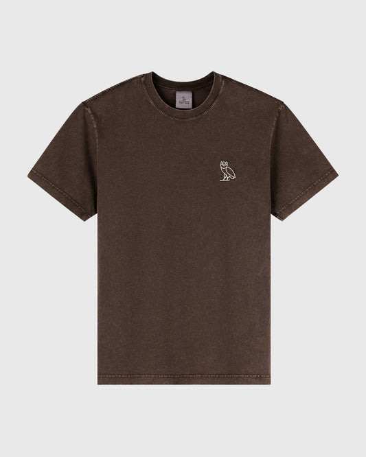 Brown garment-dyed t-shirt with small white owl emblem on chest.