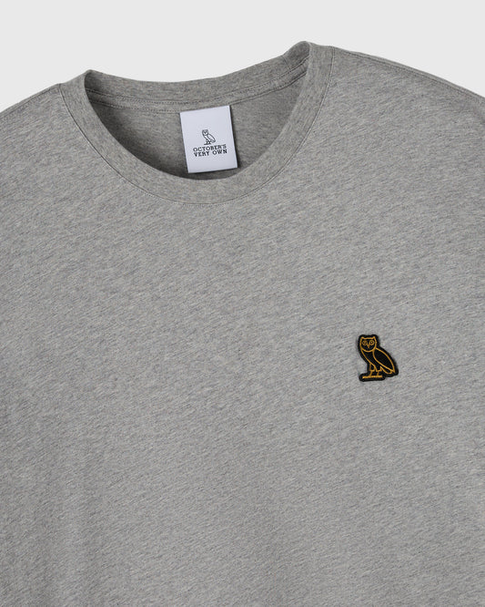 Heather grey long-sleeve tee with crew neckline and small owl embroidered on chest.
