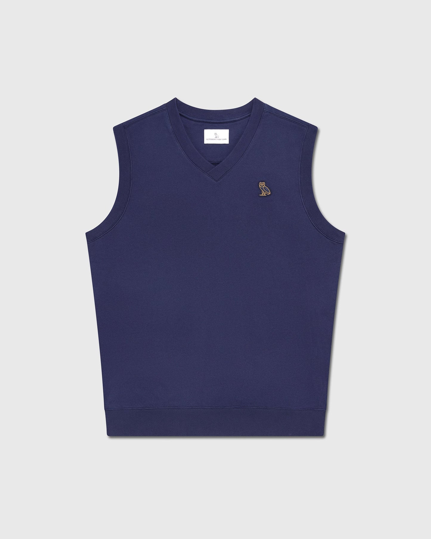 Navy blue sleeveless vest with V-neckline and small embroidered logo on chest.