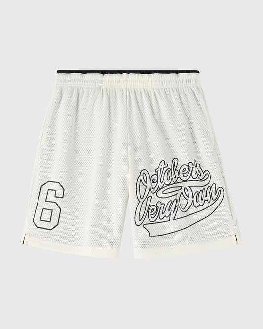 Cream mesh shorts with black waistband, number 6 on left leg and outlined text graphic on right leg.