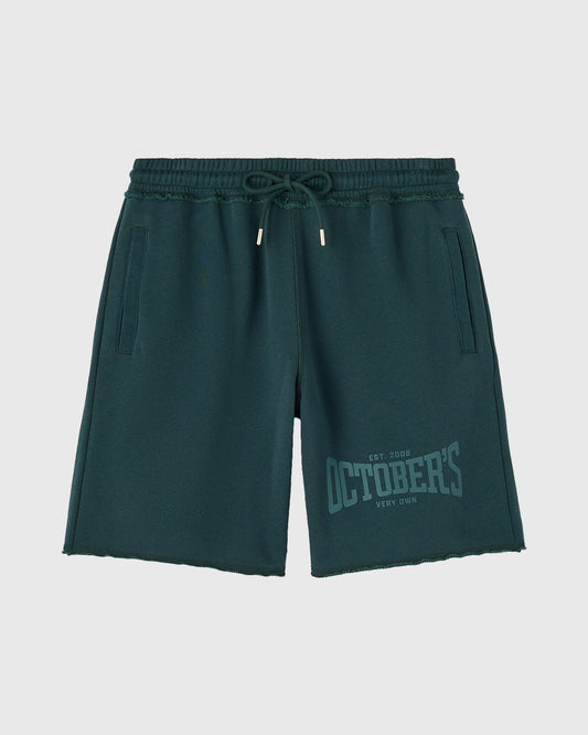 Midnight green sweatshort with drawstring waistband, side pockets, and graphic text on thigh.