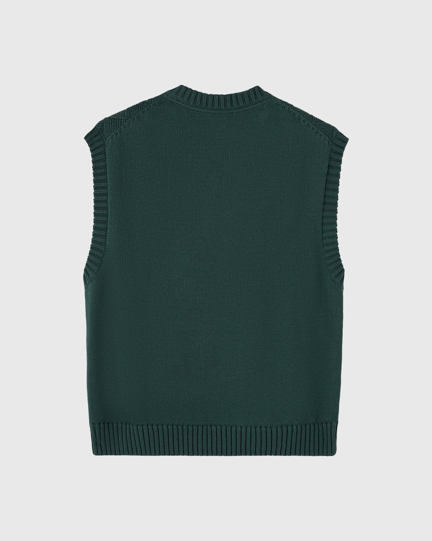 Midnight green sleeveless sweater vest with basketweave knit texture and ribbed trim at neckline and hem.