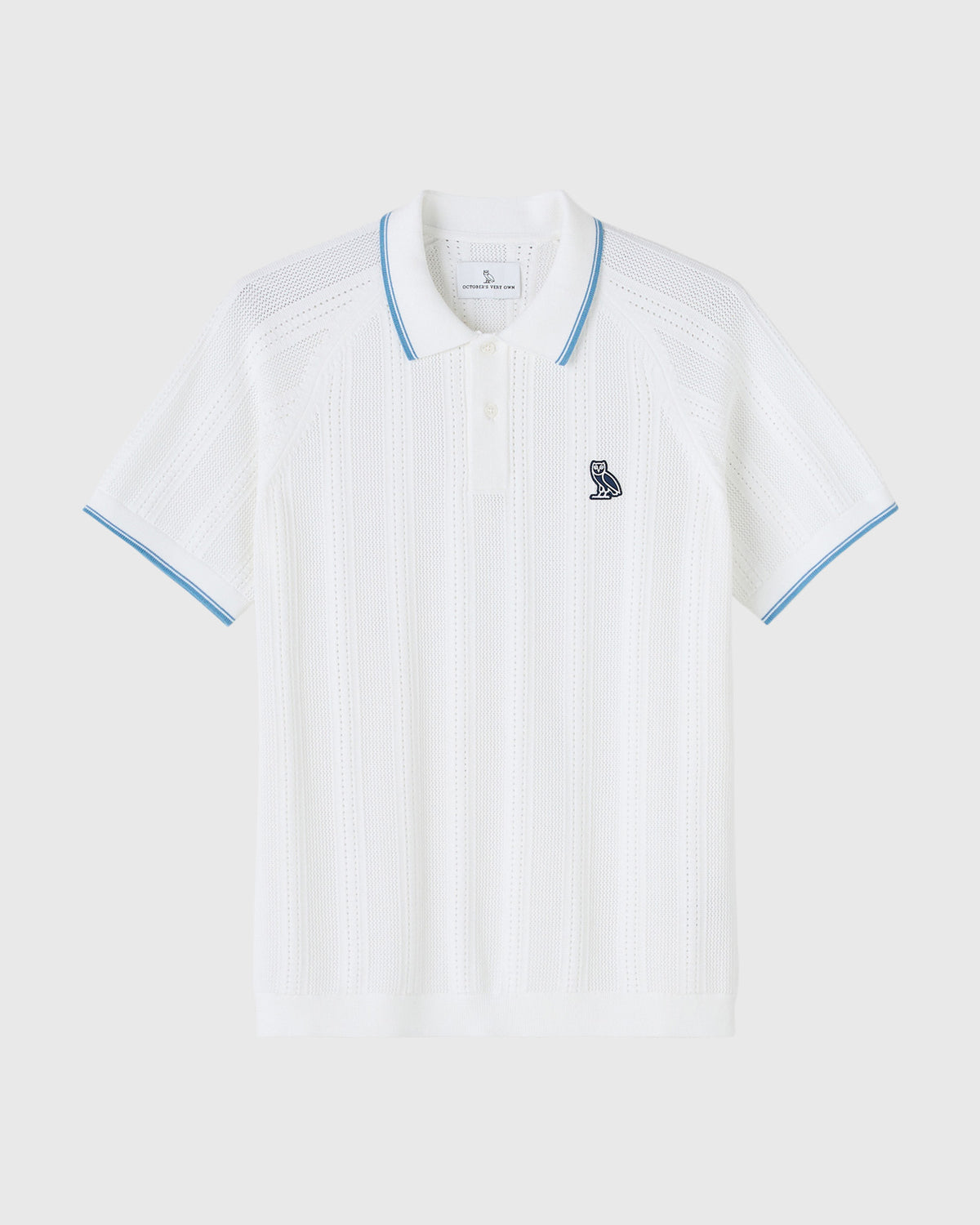 White open knit polo shirt with blue trim on collar and sleeves, small owl emblem on chest.