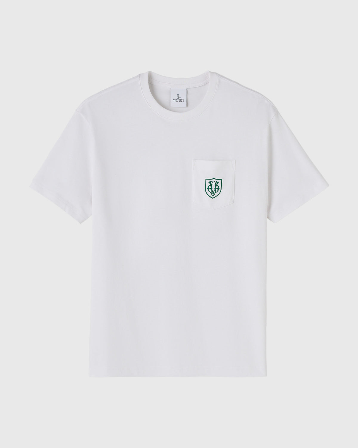 White short-sleeve t-shirt with chest pocket featuring small green owl shield logo.
