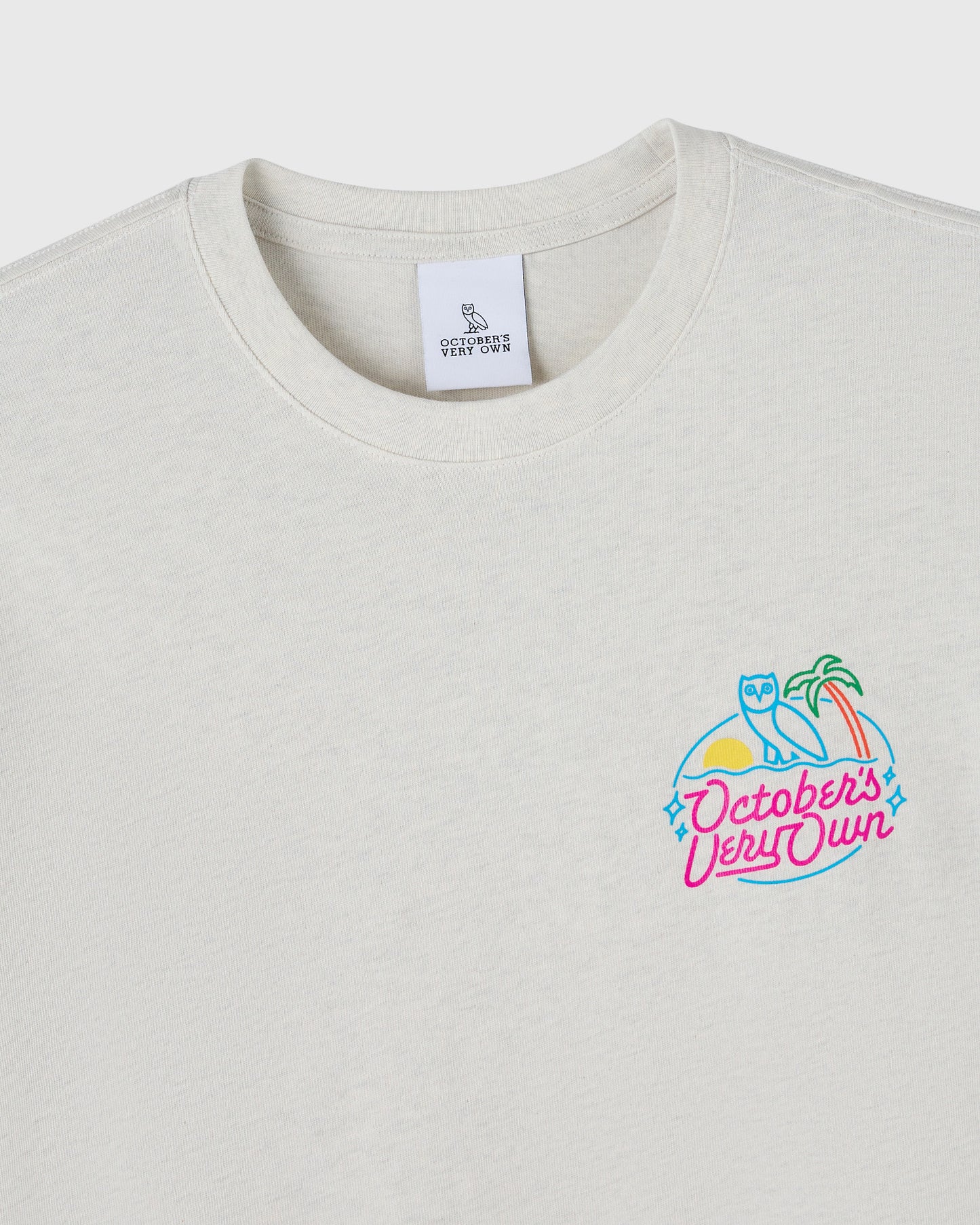 Ash heather grey t-shirt with neon graphic featuring an owl, palm tree, and "October's Very Own" text on chest.