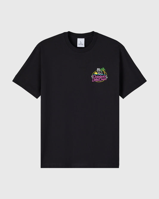 Black crewneck t-shirt with neon-colored graphic print on chest featuring skeleton and text design.