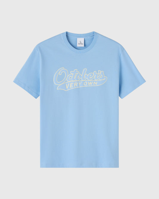 Light blue t-shirt with cream script text reading "October's Very Own" across the chest.
