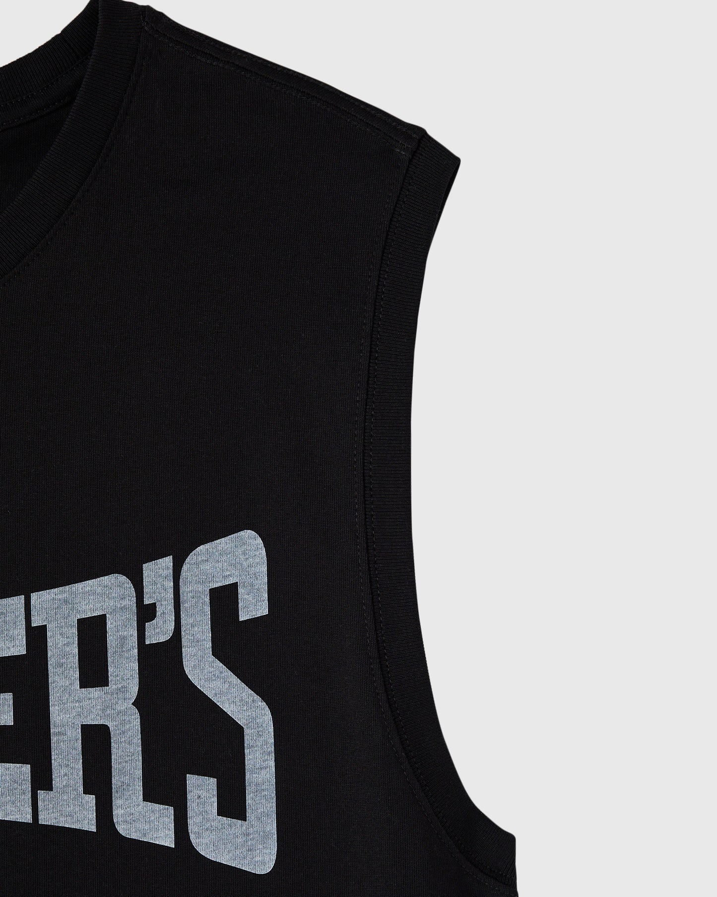 Black sleeveless tank top with gray block lettering on chest and ribbed trim.