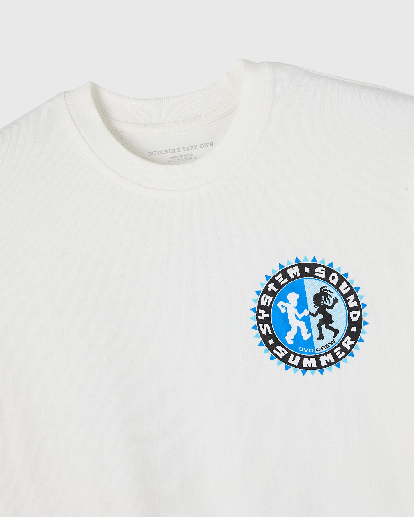 Off-white t-shirt with blue and black circular graphic print on chest featuring stylized figures and spiky border design.