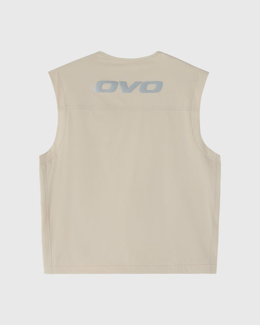 Sandstone sleeveless vest with OVO logo printed on back.