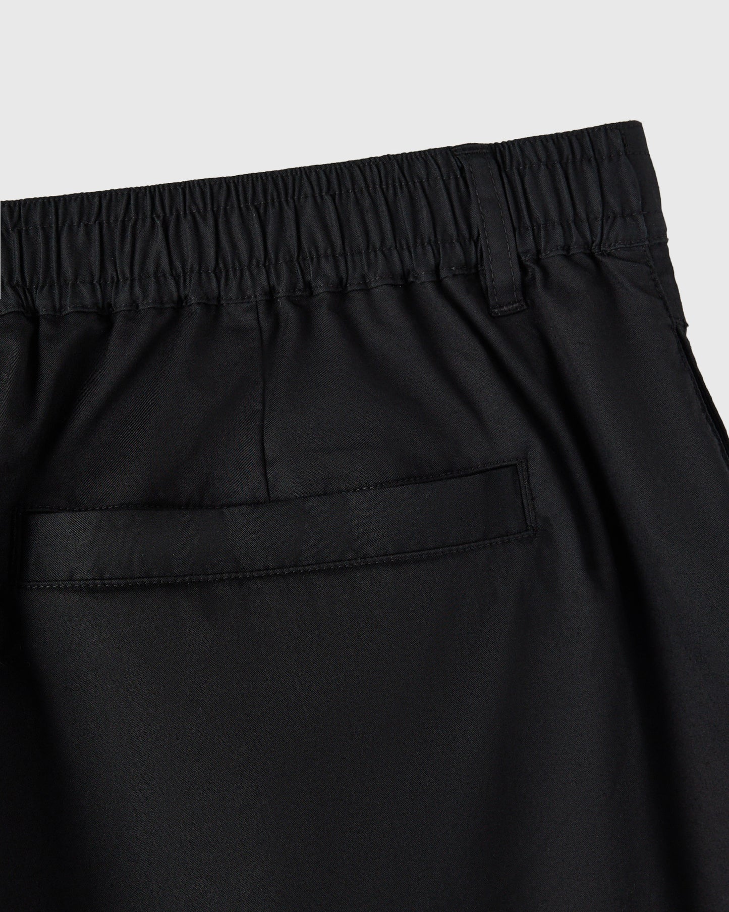 Black shorts with an elastic waistband and back pocket detail.