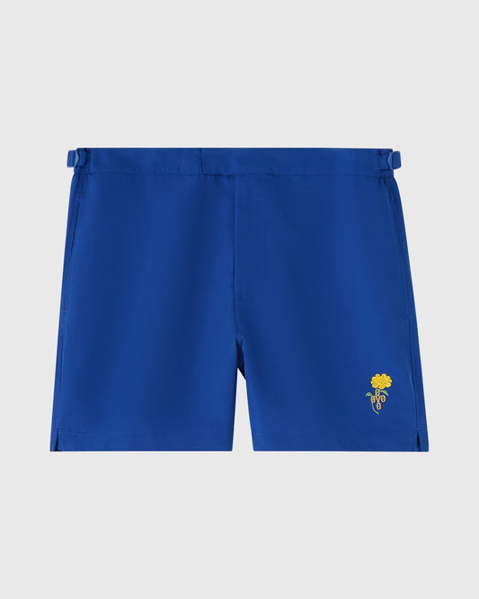 Midnight blue swim shorts with yellow marigold embroidery on lower right leg and adjustable side tabs.