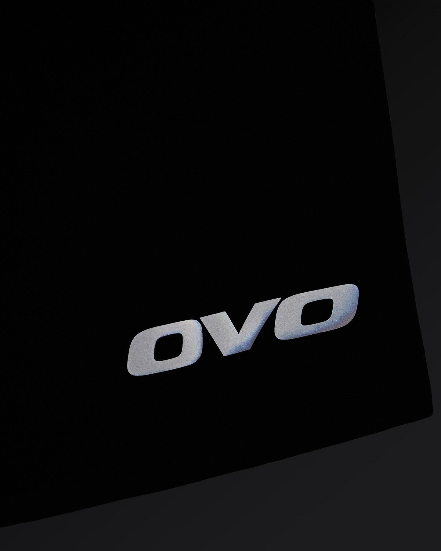 Midnight green golf shorts with OVO logo on thigh and angled seam detail.
