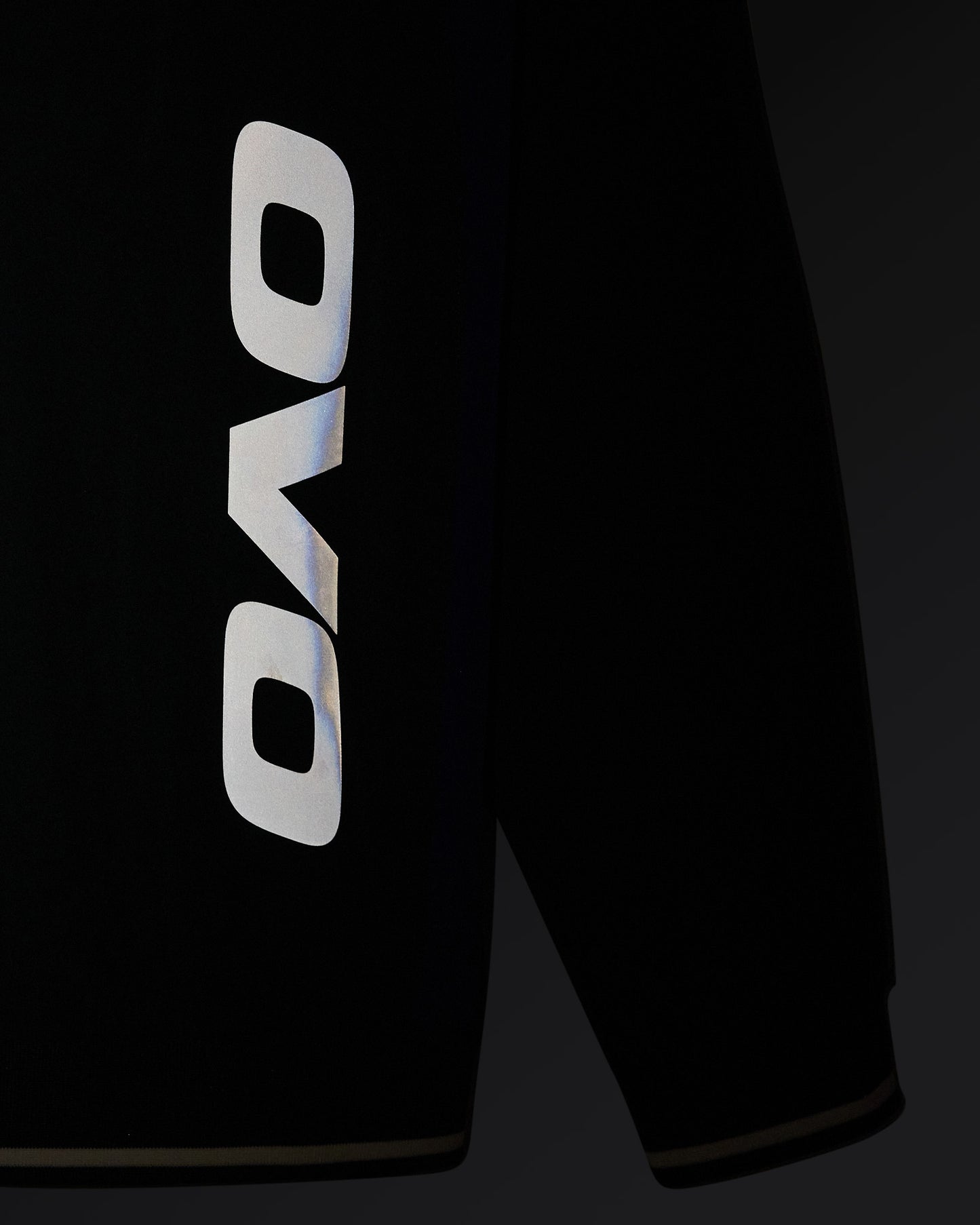 Midnight green stretch nylon pullover with OVO logo on chest and V-neckline.
