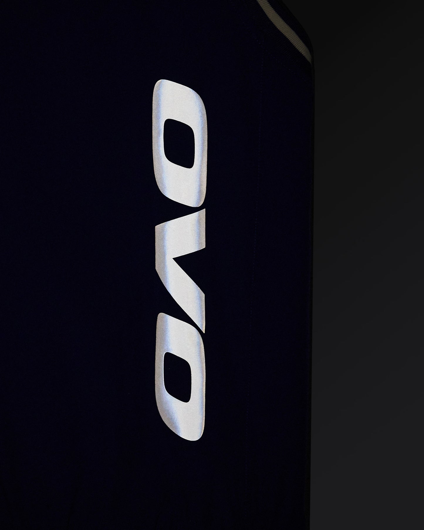Deep denim pullover vest with white OVO logo on chest.