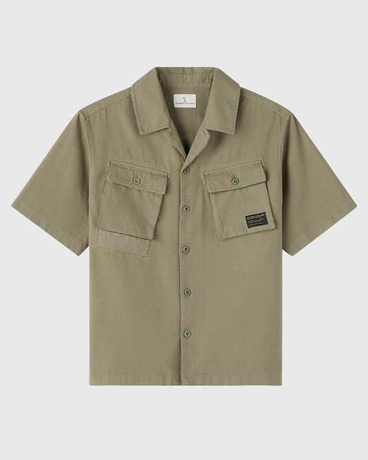 Olive green short-sleeve camp shirt with dual chest pockets, button front, and spread collar.