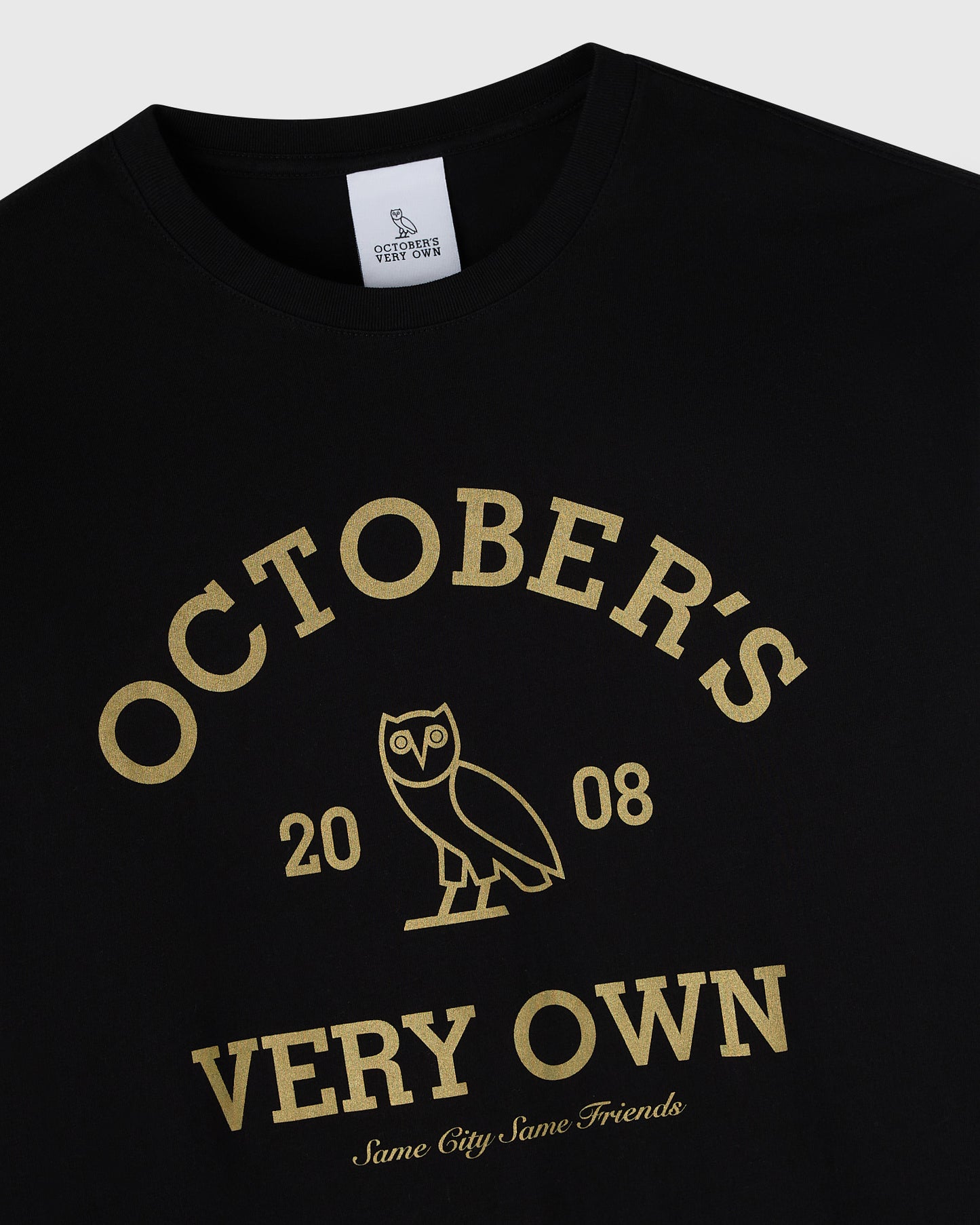 Black long-sleeve tee with gold "Octobers Very Own" text, owl graphic, and "2008" print on chest.