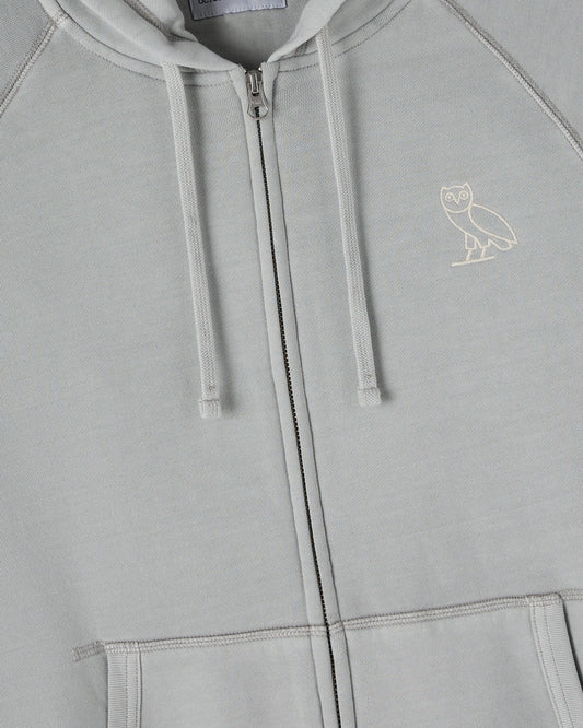 Gray raglan full-zip hoodie with white drawstrings and small owl emblem on chest.