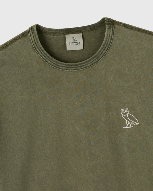 Cypress green long-sleeve tee with crew neckline and small owl emblem on chest.