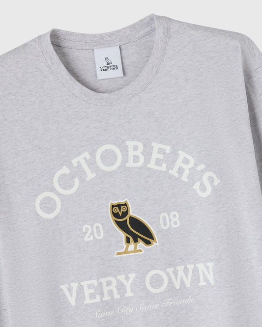 Ash heather grey long-sleeve tee with "October's Very Own" text, owl graphic, and "2008" printed on chest.