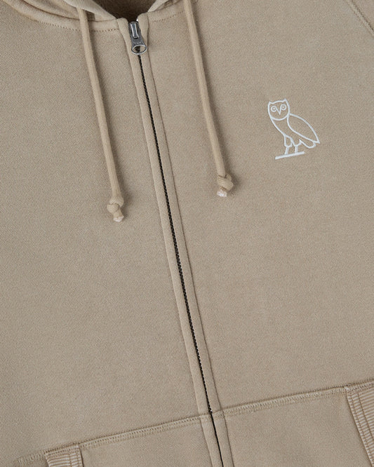 Sandstone raglan hoodie with full-length zipper, drawstring hood, and white owl emblem on chest.