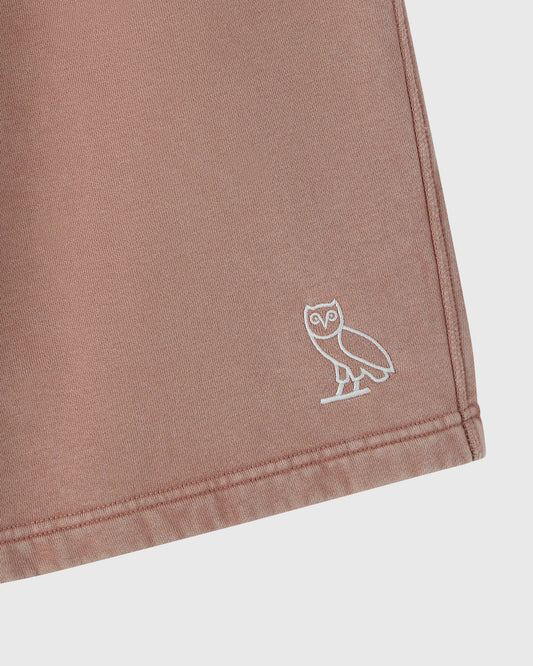 Clay pink sweatshort with white owl embroidery on thigh.