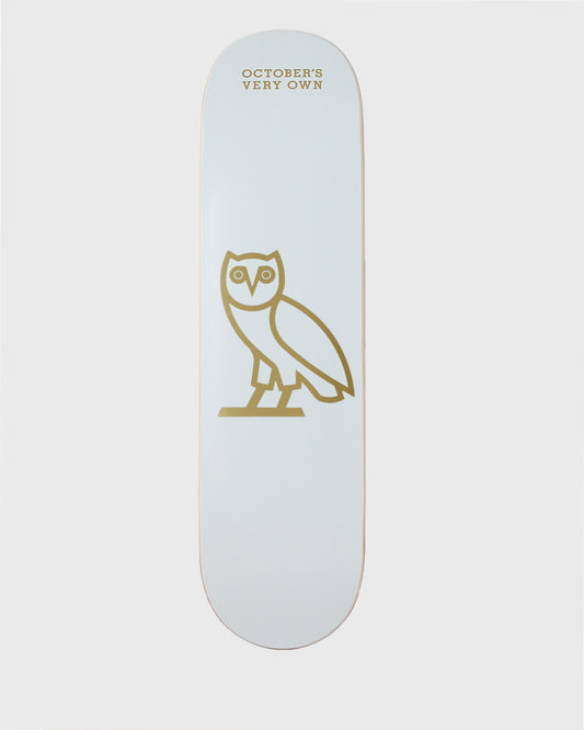 White skateboard deck with gold owl icon and "October's Very Own" text.