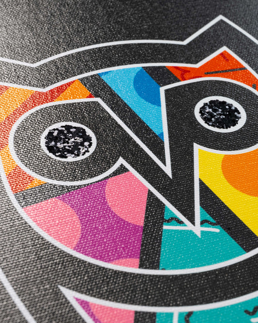 Colorful abstract print featuring stylized faces with geometric patterns in orange, blue, pink, yellow, and teal on textured
