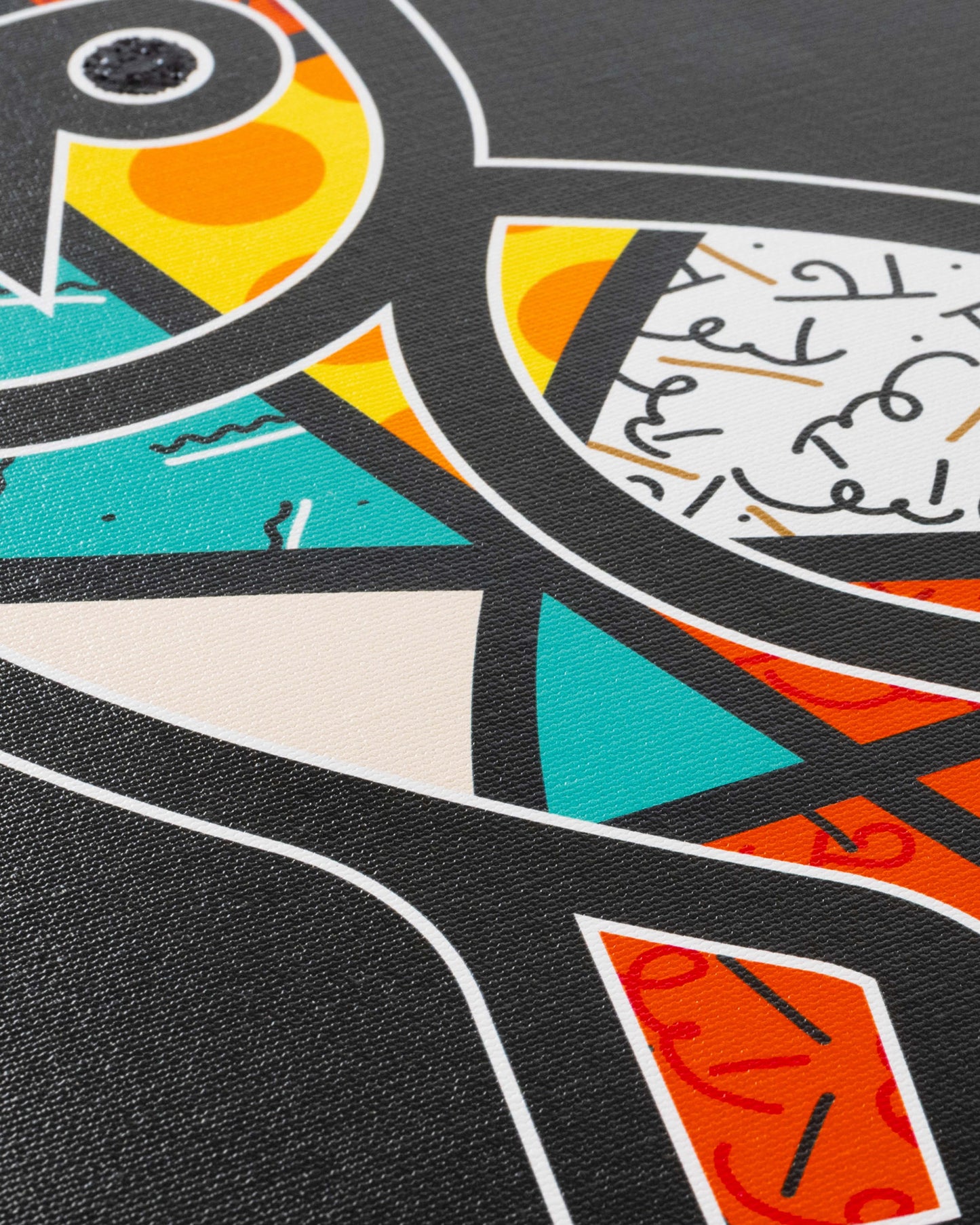 Colorful abstract print featuring stylized faces with yellow, orange, turquoise, and red sections on dark background with whi