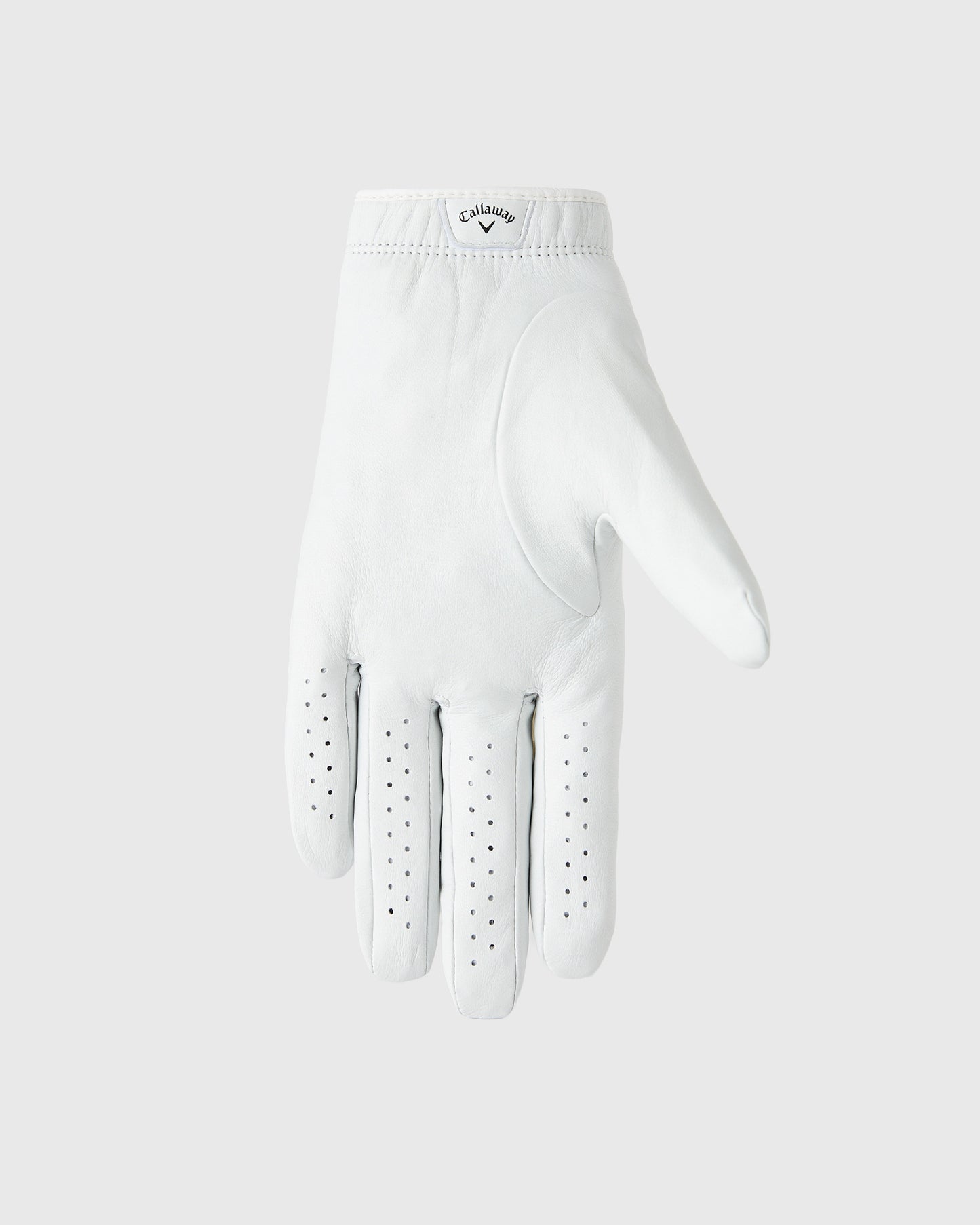 White leather golf glove with perforated finger panels and Callaway branding on cuff.