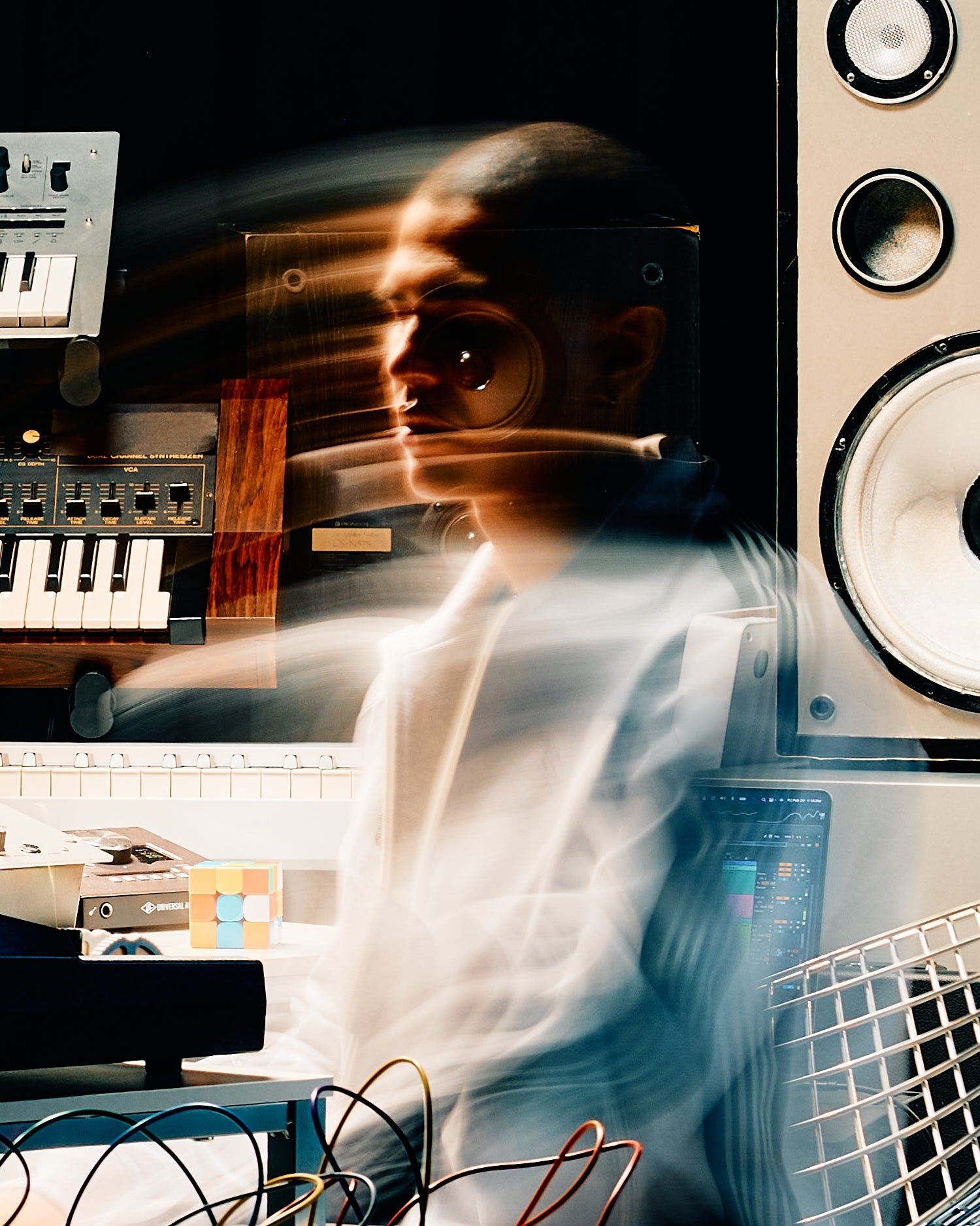 Person in a music studio with electronic equipment