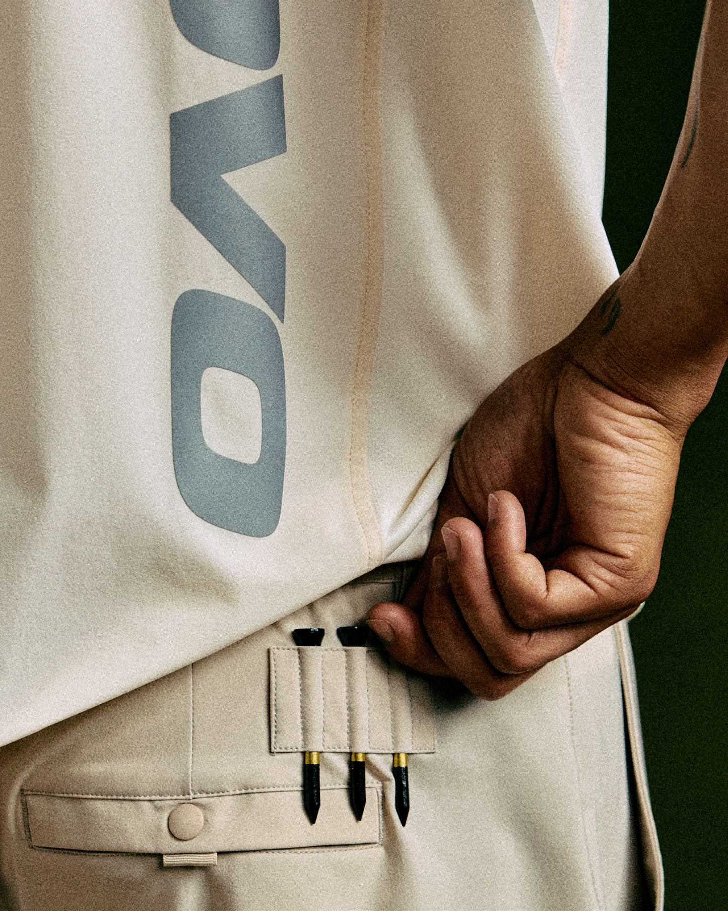 Sandstone golf shorts with OVO logo and side pocket detail on wearer.