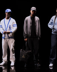 Translation missing: fr.Two men in stylish outfits with a black background