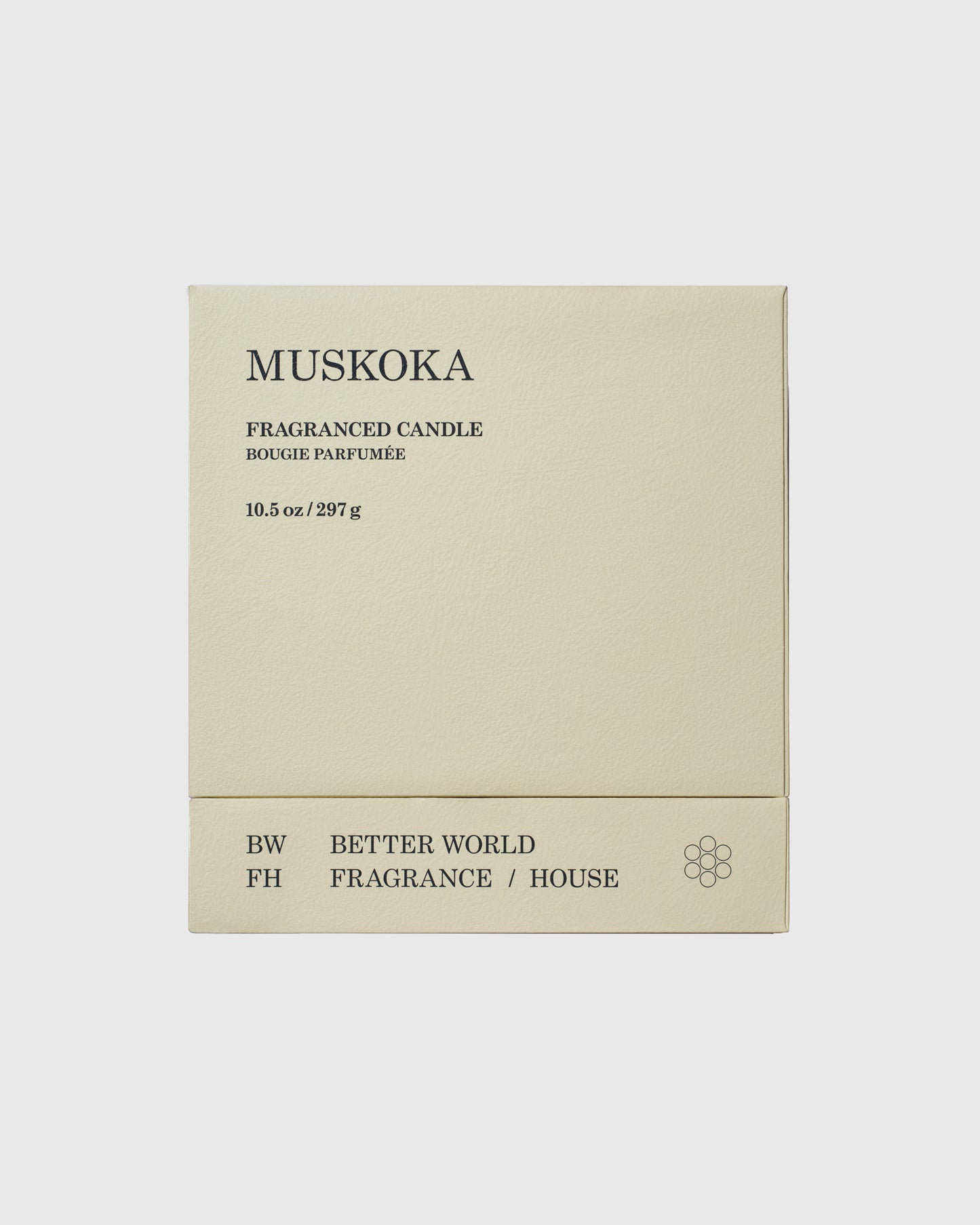 Cream-colored candle box labeled Muskoka Fragranced Candle, 10.5 oz, with Better World Fragrance House branding and flower lo