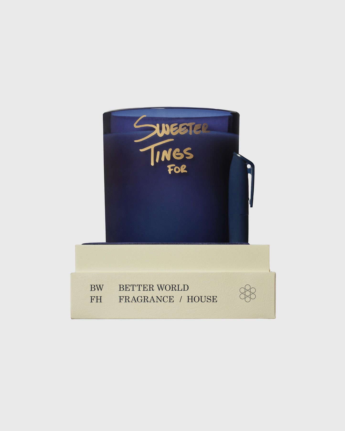 Dark blue candle with gold text reading "Sweeter Tines For" in a cream-colored box labeled Better World Fragrance House.