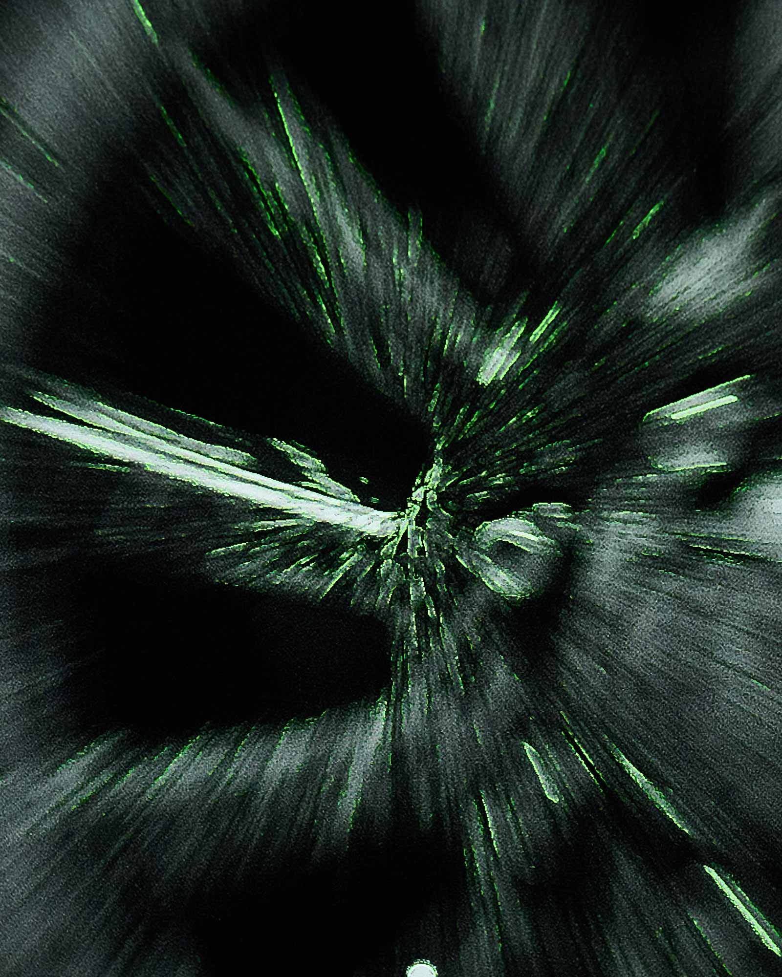 Abstract green and black pattern on a dark background