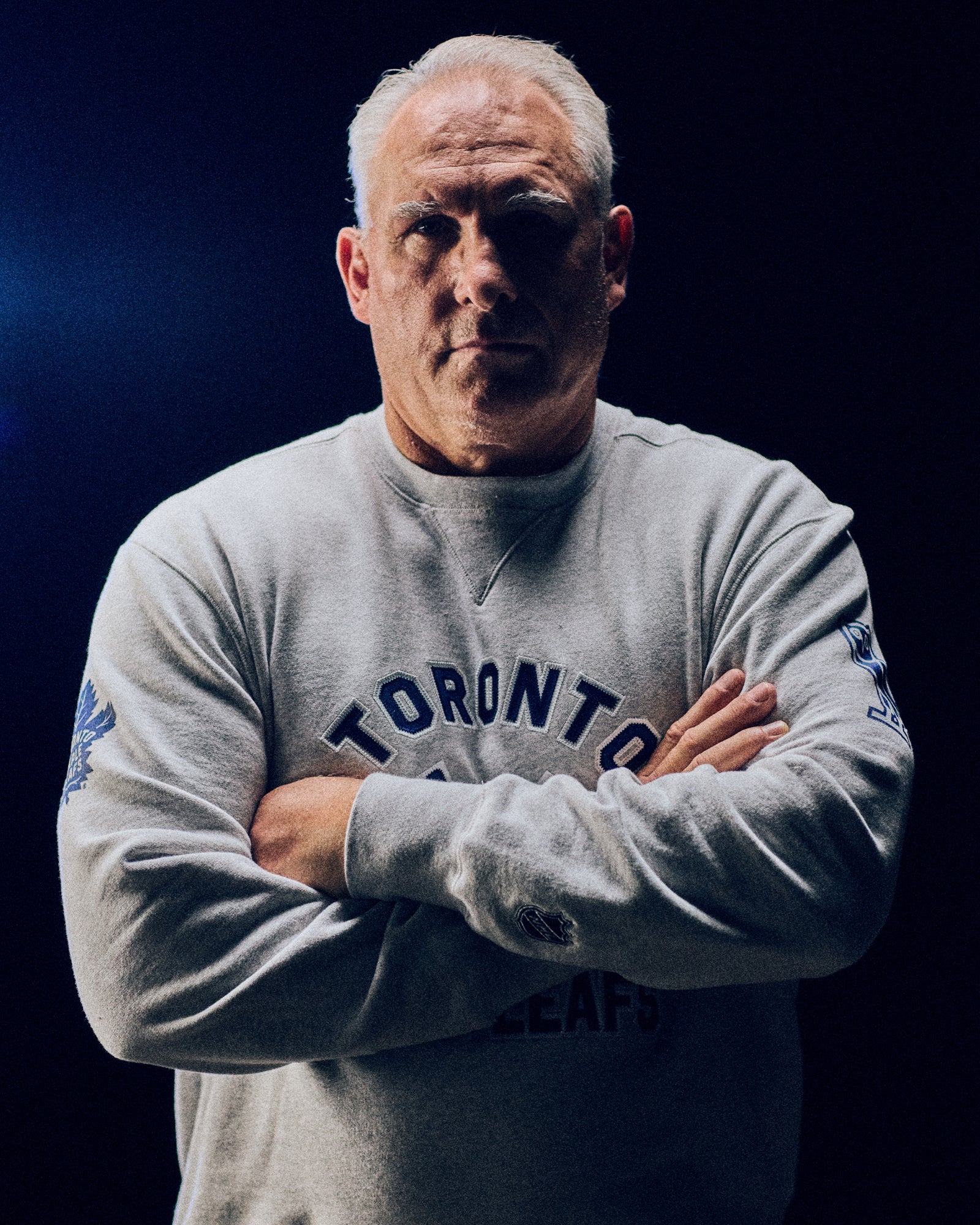 Craig Berube wearing a October's Veryn x NHL crewneck sweater