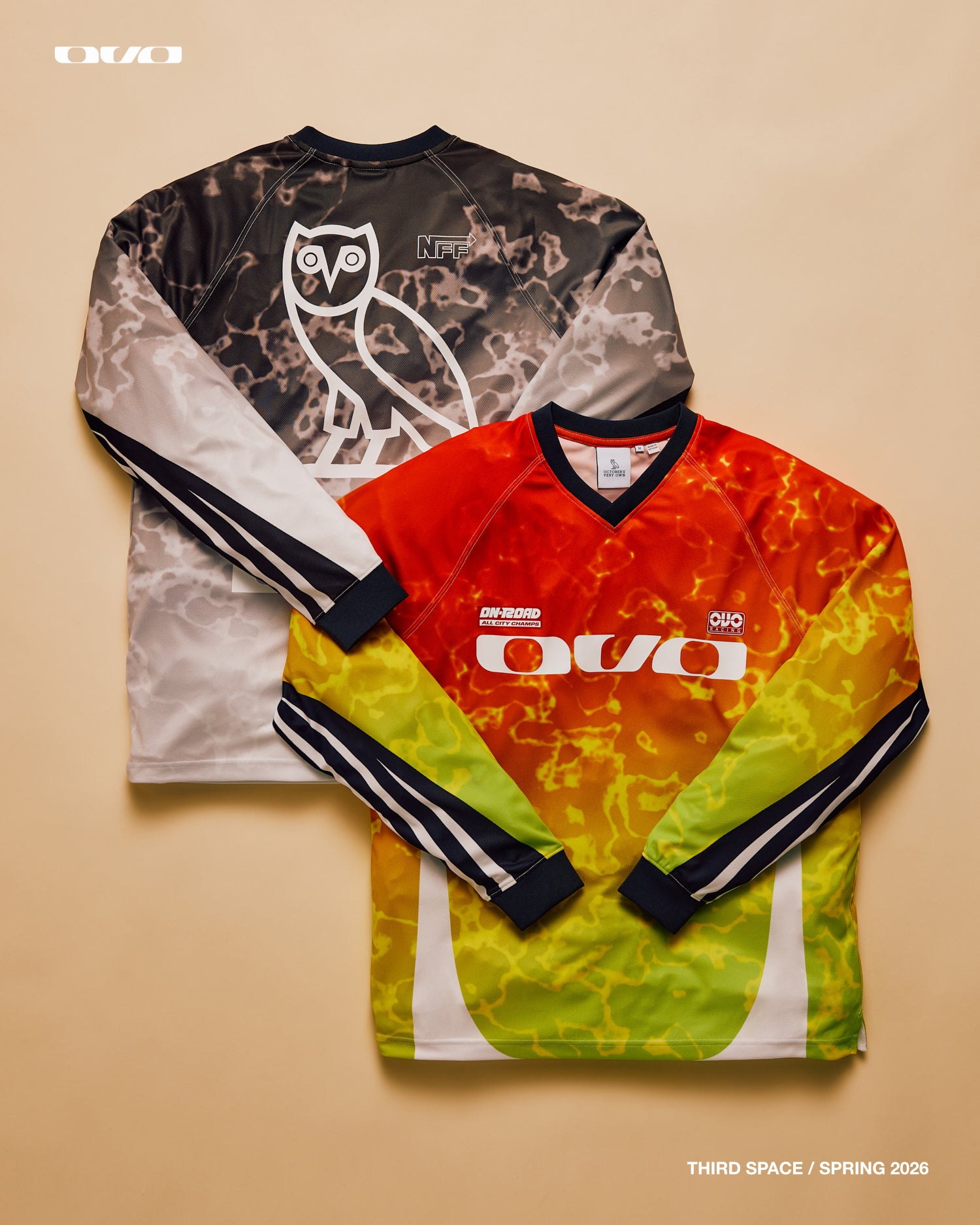 Two long-sleeve shirts with OVO logo on a beige background