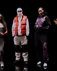 Translation missing: fr.Three people wearing stylish outfits with a black background