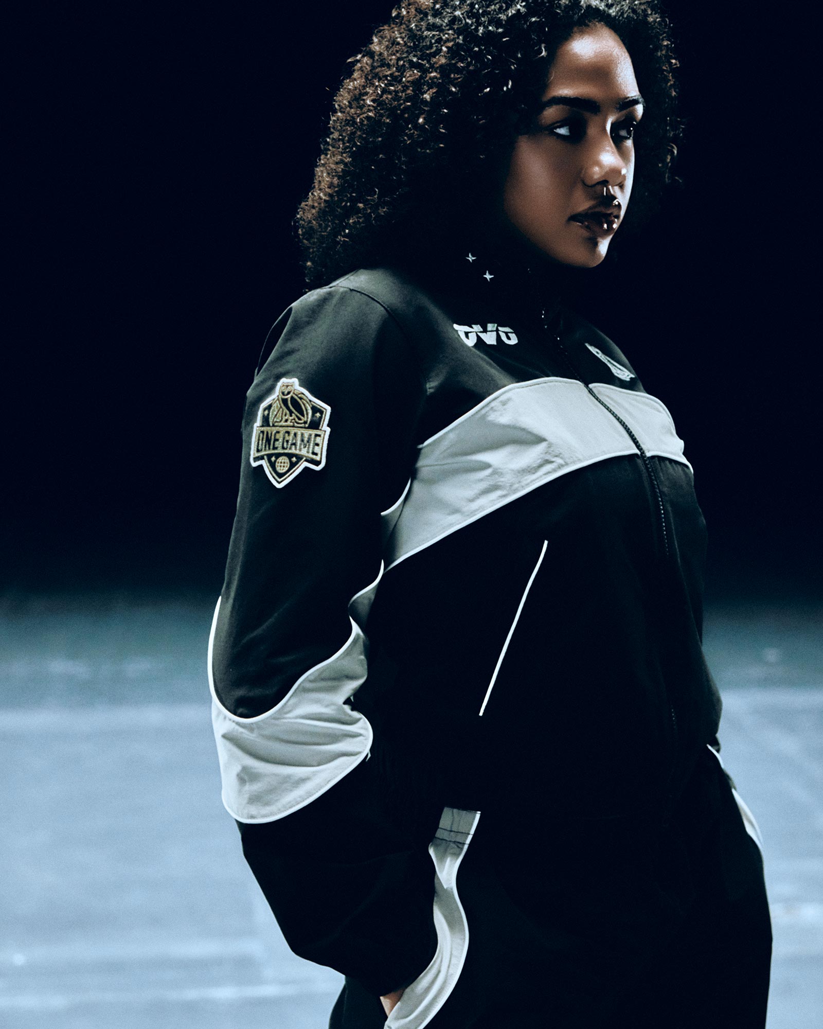 Person wearing October's Very Own / WNBA track suit