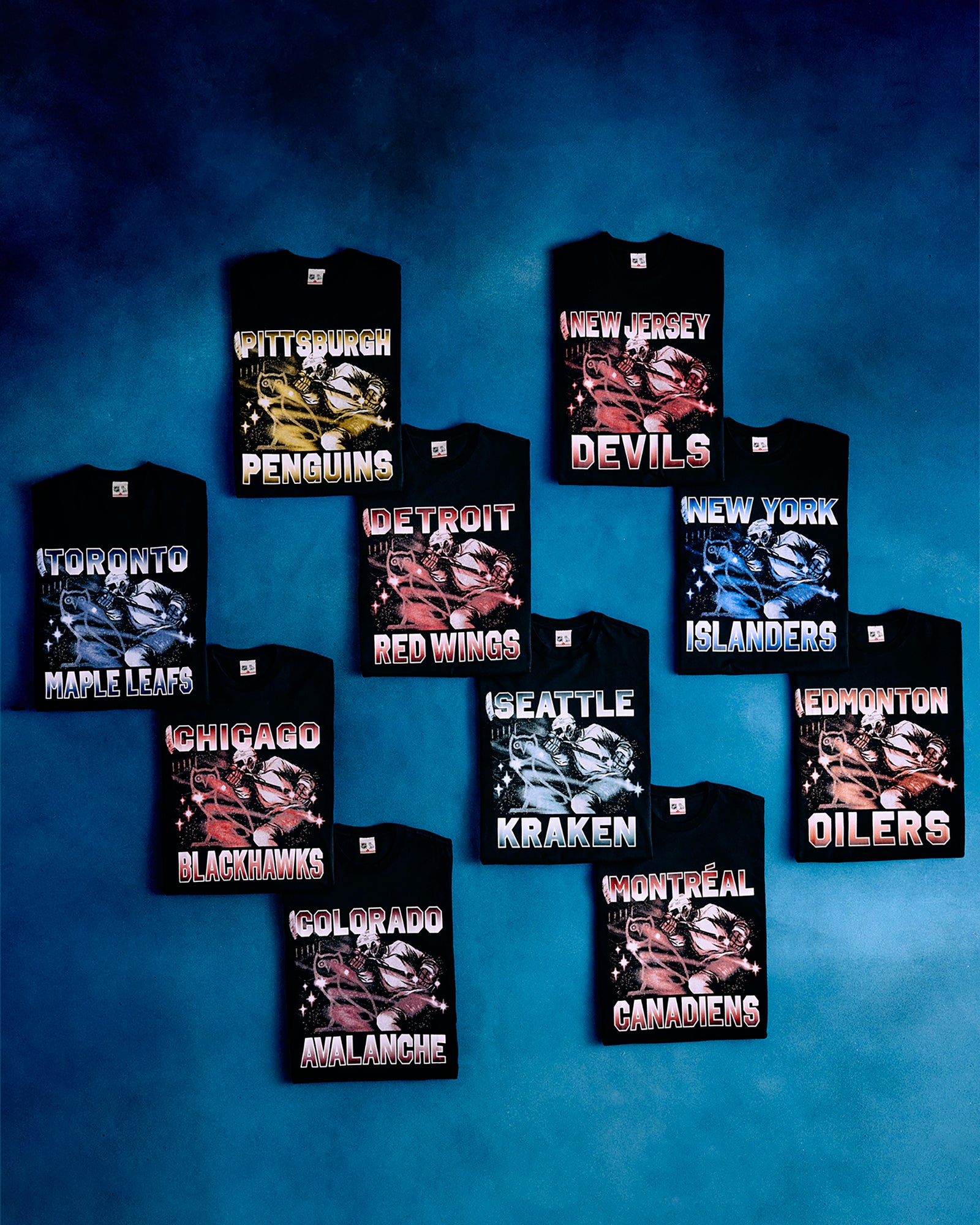 Collection of October's Very Own hockey team-themed t-shirts on a blue background