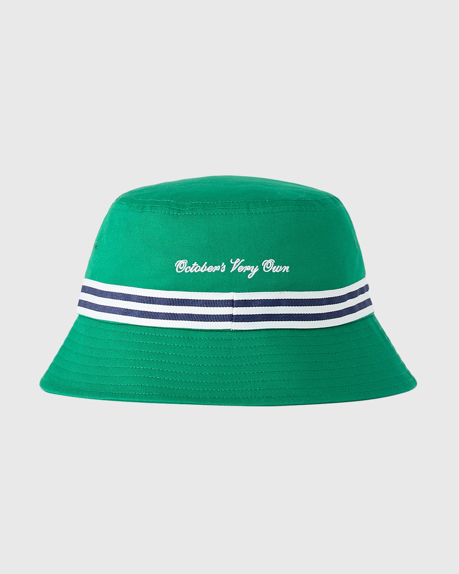 Green bucket hat with white "October's Very Own" embroidery and navy and white striped band.