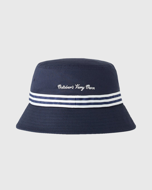 Navy bucket hat with white cursive text on crown and navy and white striped band around base.