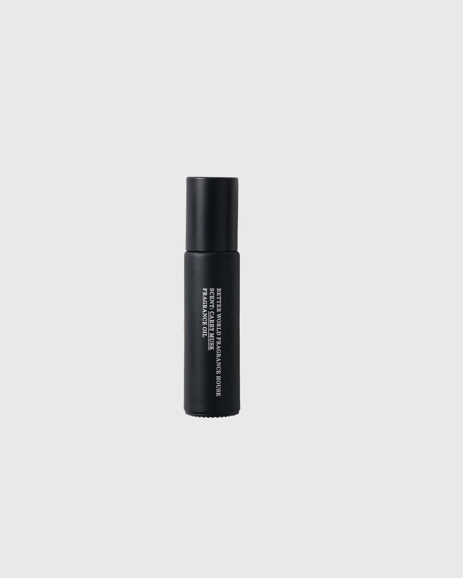 Black roller ball fragrance oil bottle with white text label and cylindrical cap.