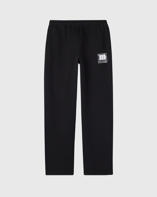 Black sweatpants with OVO Sound logo patch on right thigh and elastic waistband.