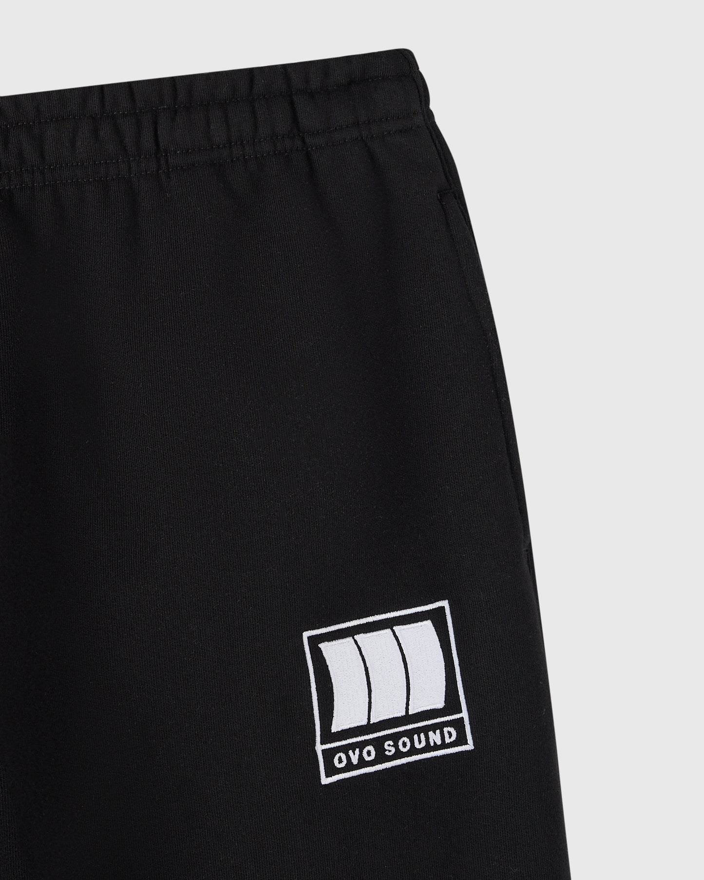 Black sweatpant with OVO Sound logo graphic on thigh and elastic waistband.