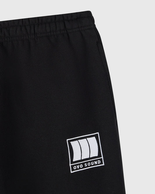 Black sweatpant with OVO Sound logo graphic on thigh and elastic waistband.