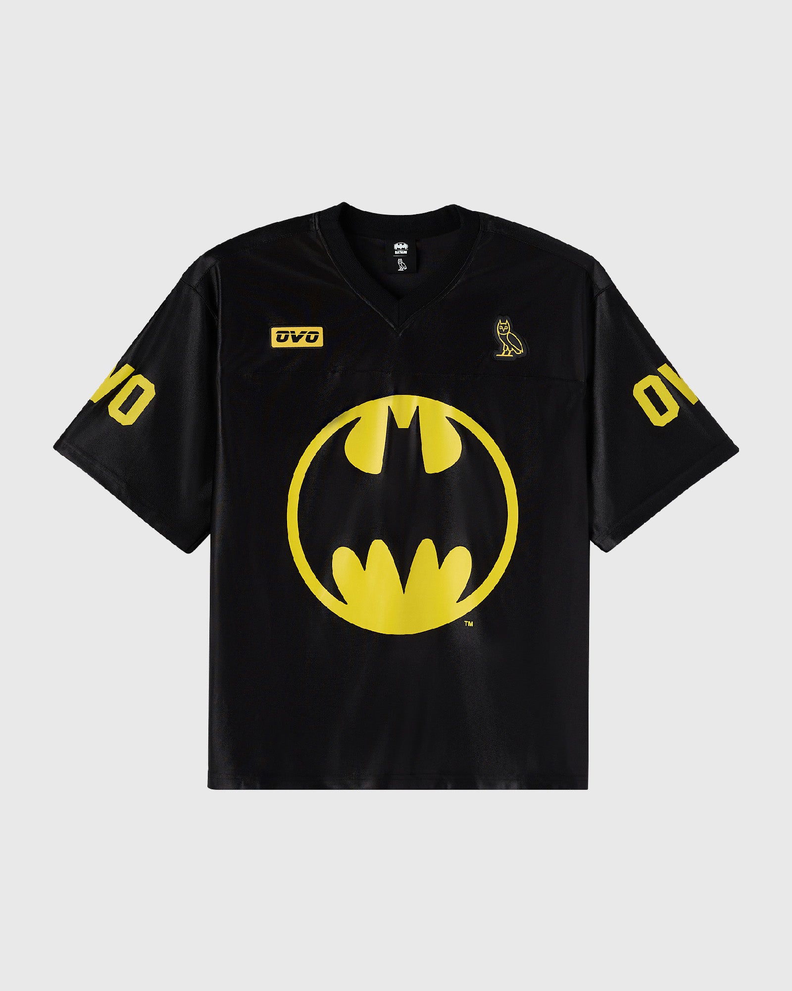 Black football jersey with large yellow Batman logo on chest, yellow number 00 on sleeves, and small yellow owl graphic on ri